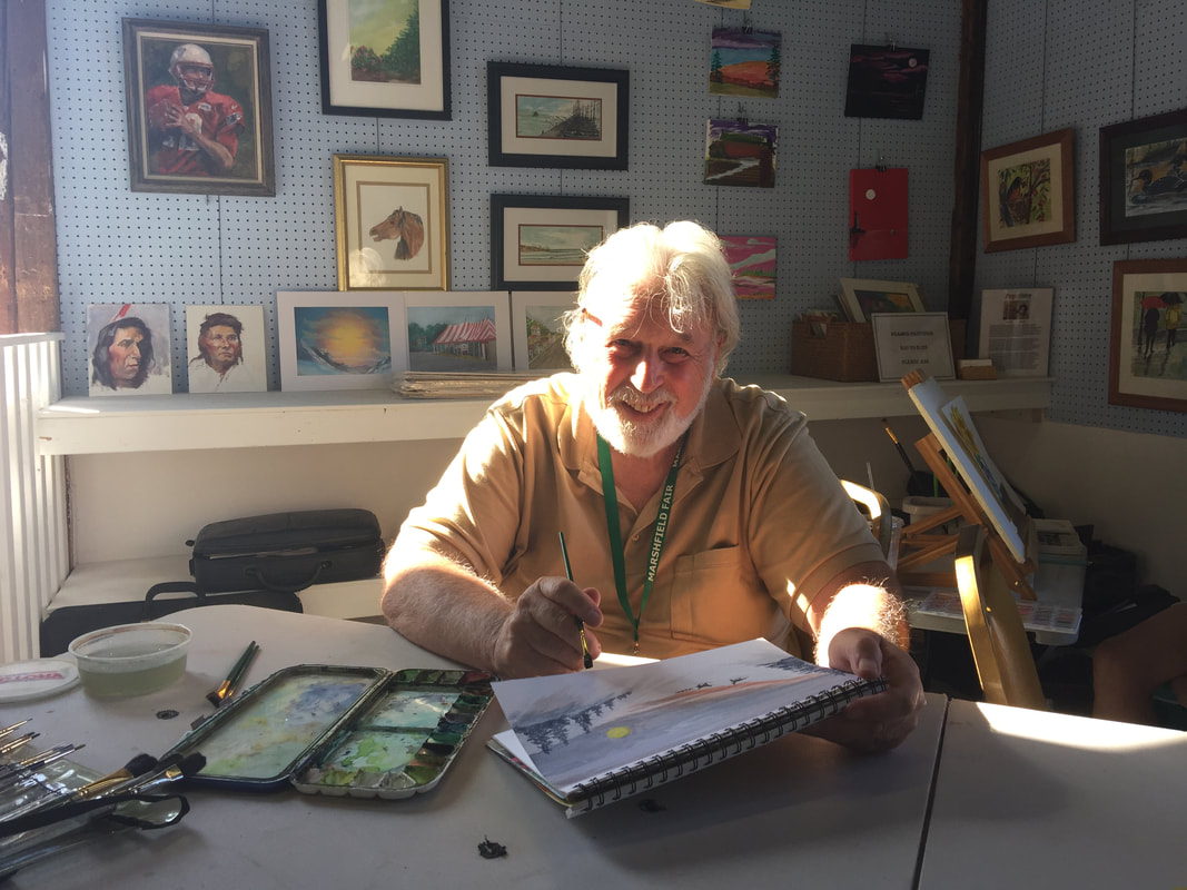 Fred Dolan painting in their studio